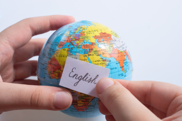 A picture of globe and a piece of paper with the word 