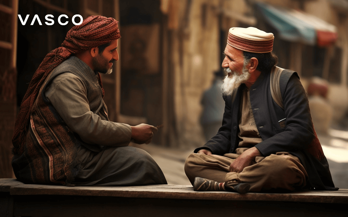 Two Arabic people speaking with each other. 