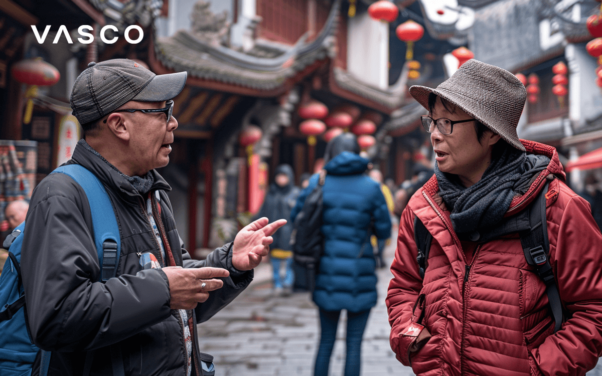 Two tourists are speaking to each other. 