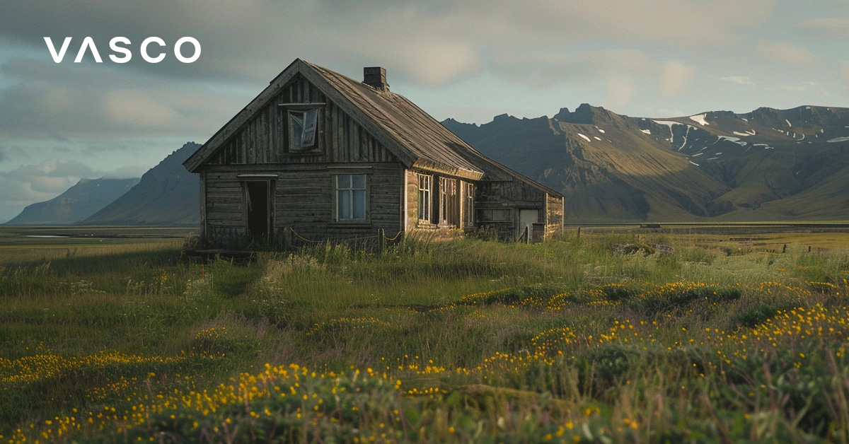 A small wooden cottage with Icelandic mountains in the back. 