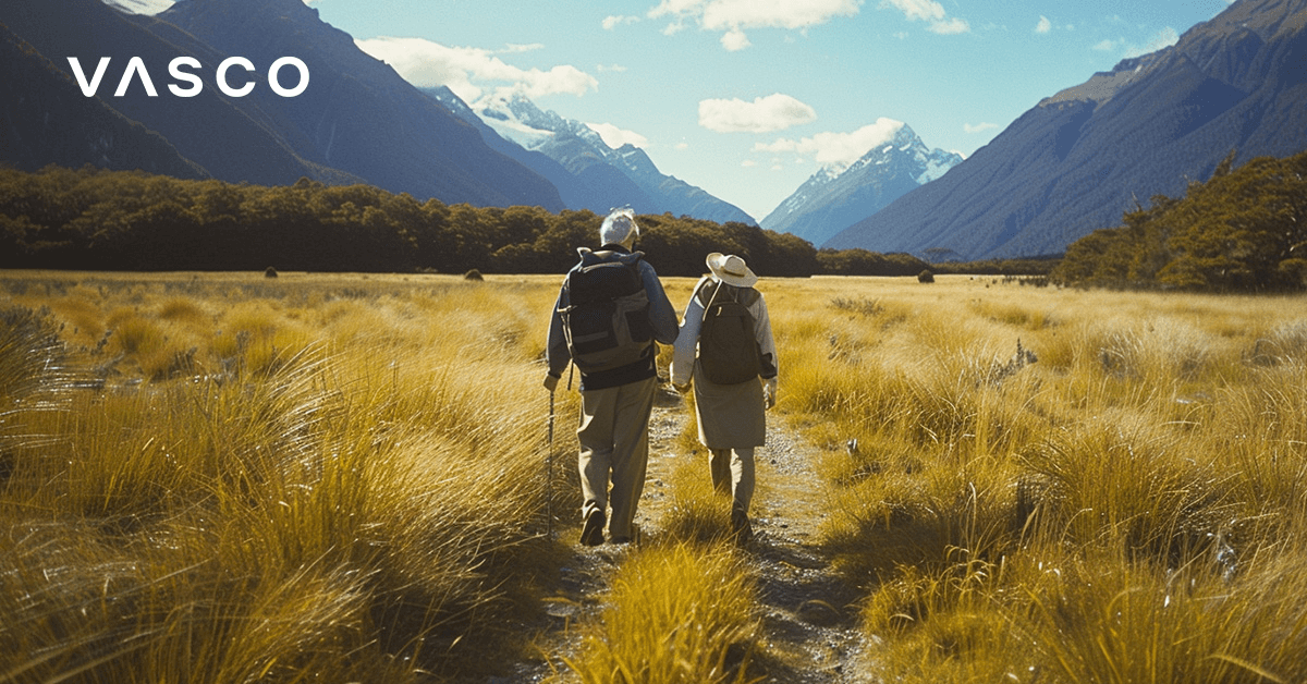 A senior couple hiking in the mountains. 