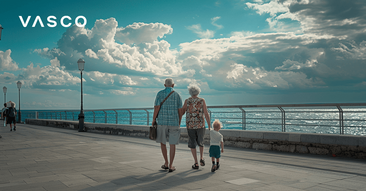 An elderly couple with a young child walking the aisle by the beach.