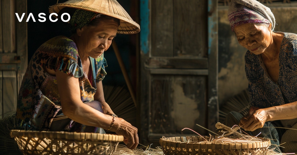 Two women working with baskets indoors, depicting Vietnam holidays in October.