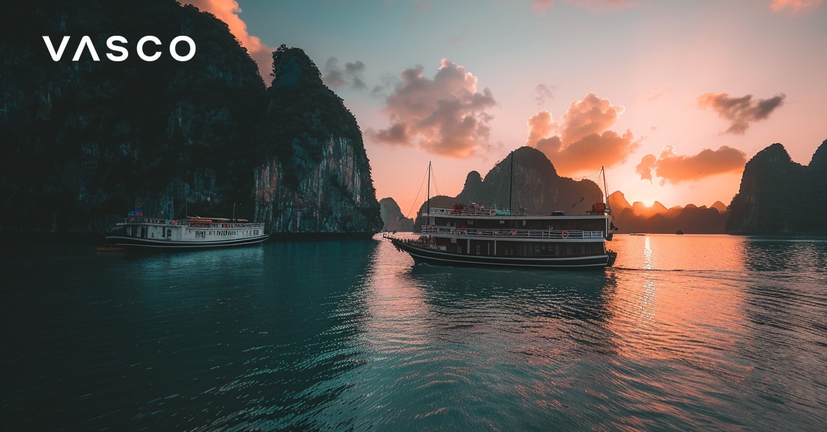 Boats on a serene waterway during sunset, highlighting where to go in October for vacation and the temperature in Vietnam.