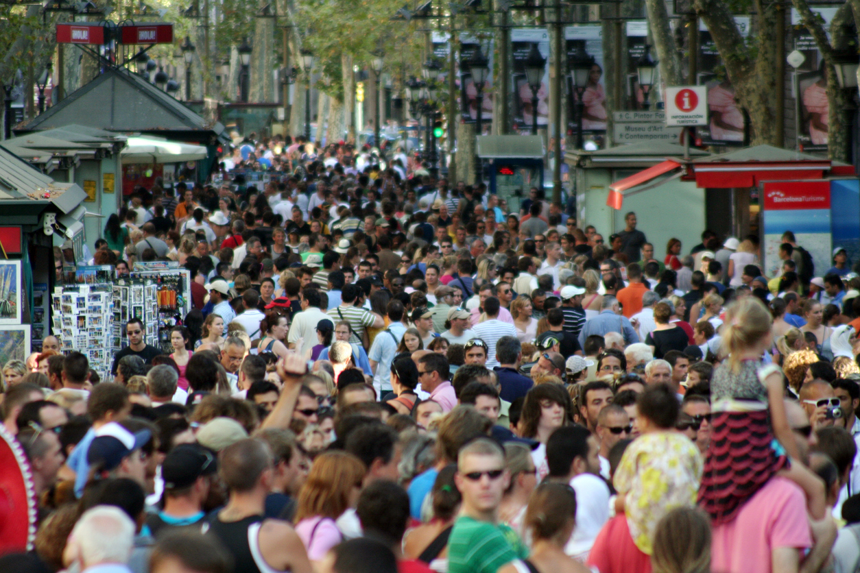 Famous street La Rambla in Barcelona, Spain. Thousands of people walk daily by this popular pedestrian area 1.2 kilometer long.