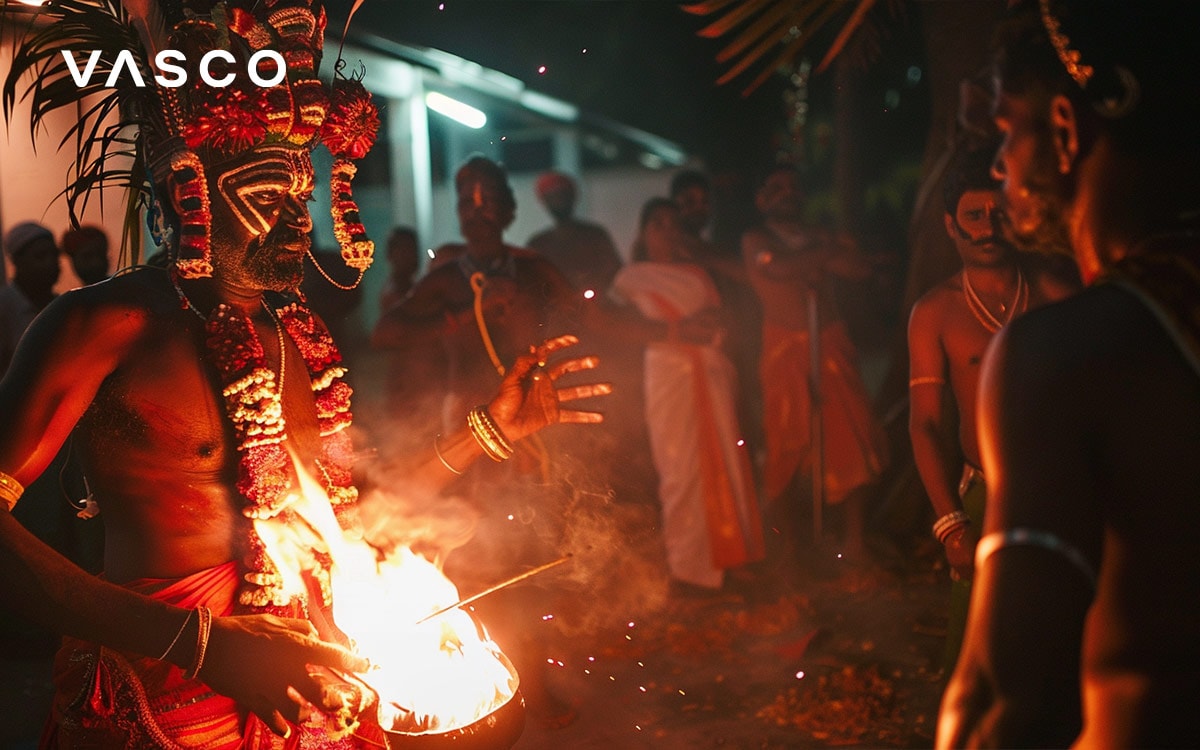 Traditional performer in cultural attire engaging in a ritual, with an audience in the background