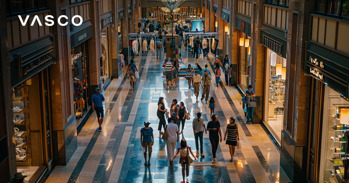 Indoor shopping mall in Dubai with crowds and luxury stores
